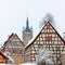 Historic, medieval half-timbered houses and old tower in Bad Wimpfen, Germany. Winter photo.