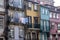 Historic old city buildings facades and with clean laundry on balconies, Porto, Portugal