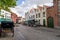 The historic old town of Brugge with horse-drawn carriages and brick buildings