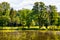 Historic park surrounding XVI century Rozalin Palace with vintage trees and ponds in Rozalin village in Mazovia region of Poland