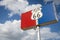 Historic Road 66 road sign against a blue sky with clouds in the State of Texas, USA