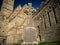 Historic Rock of Cashel castle with celtic gravestone