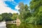 Historic ruin called `Kirchenruine zum heiligen Grab` in front of pond in public park called `SchÃ¶ntal` in Aschaffenbrug, Germany