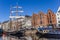 Historic sailing ship and warehouses in the canals of Groningen