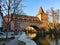 Historic sight Schlayerturm with bridge Kettensteg over river Pegnitz