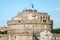 Historic sights of building architecture Castel Sant\'Angelo in Rome, on the banks of the Tiber River near the arched bridge across