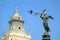 Historic Statue of Angel of the Fame on the Fountain at Plaza Mayor in Lima with Relaxing Doves