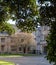 Historic stone building with gothic windows on the campus at Magdalen College, University of Oxford, UK.