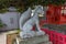 Historic stone statue of fox, or kitsune, messenger of the God Inari, at Nomachiinari shinto shrine in Kanazawa,