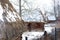 Historic thatched wooden houses in skansen in Lublin - winter landscape