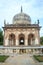Historic tomb building with landscaped garden in Qutb Shahi Archaeological Park, Hyderabad, India