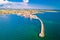 Historic town of Umag and harbor breakwater aerial view