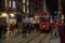 Historic tram on Taksim Istiklal avenue surrounded by crowd of people, Istanbul, Turkey. Night scene. Tourist attraction