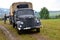 Historic truck with two men dressed in german nazi uniforms during historical reenactment of World War 2 battle