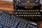 Historic typewriter and modern keyboard that show the progress of the last 100 years