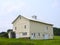 Historic upstate NY board & batten wood barn with gable roof ventilation cupola