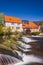 Historic water mill in Buchfart on the Ilm river near Weimar with a waterfall at the water weir