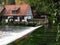 Historic water powered hammer mill at karstic spring