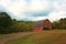 Historic, weathered old barn on a hill