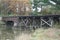 Historic, weathered rail bridge over water