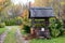 Historic well with a wooden roof farmhouse yard