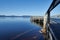 Historic wharf leading onto blue ocean with mountains