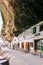 Historic whitewashed dwellings under cliff overhangs along the Rio Trejo