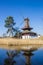 Historic windmill reflecting in the water in Gifhorn