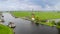 Historic windmill by the river called Zwanburgermolen near Warmond, Netherlands