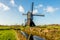 Historic wooden hollow post mill in a Dutch polder landscape