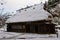 Historic wooden houses from Edo period covered in snow at Hida Folk Village in Takayama, Japan