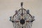 Historic wrought-iron cross with images of Saints and angels. Austria.