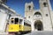 Historic yellow tram in front of the Lisbon Cathedral, Portugal