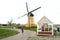 Historic yellow windmill at the port of Bruinisse in Zeeland