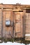 Historical abandoned wooden house with old wooden doors. Talsi, Latvia