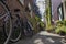 Historical alley, Arend Roelandsteeg, in the center of Leiden with bikes and plants in summer