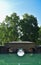 Historical and architectural Mughal garden with monumental building and trees reflecting on water taken at Kashmir valley India