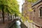Historical architecture in Delft, the Netherlands, along a typical Dutch canal.