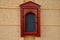 Historical box for theater program or menu. Museum or cinema program, glazed carved brown cabinet at the entrance to the building.