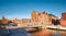 Historical brick houses in Hamburg Speicherstadt with historic metal bridge across the canal