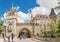 Historical building of Vajdahunyad Castle with crowds of tourists and the blue sky in main City