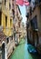 Historical buildings, clothes, water in Venice, in Europe