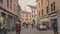 Historical buildings detail and street view with people walking in Rovigo in Italy