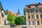 Historical buildings in the old town of Lausanne, Switzerland. Street sign saying Lausanne Cathedral Square in French. City center