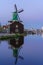 Historical buildings and windmills at dusk in Zaanse Schans, Netherlands