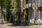 historical canal brick houses in a row. Bikes parked in front of the houses.