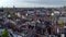 Historical Center of Amsterdam, Netherlands. Aerial Drone Shot of Traditional Dutch houses on narrow street and channel.