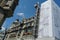 Historical city centre of Zurich in rebuilding, the facades of historical buildings are covered by white thick protective net, lat