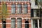 Historical facades with carvings located along Oude Delft Canal, Delft