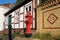 Historical fire alarm in front of an old half-timbered house